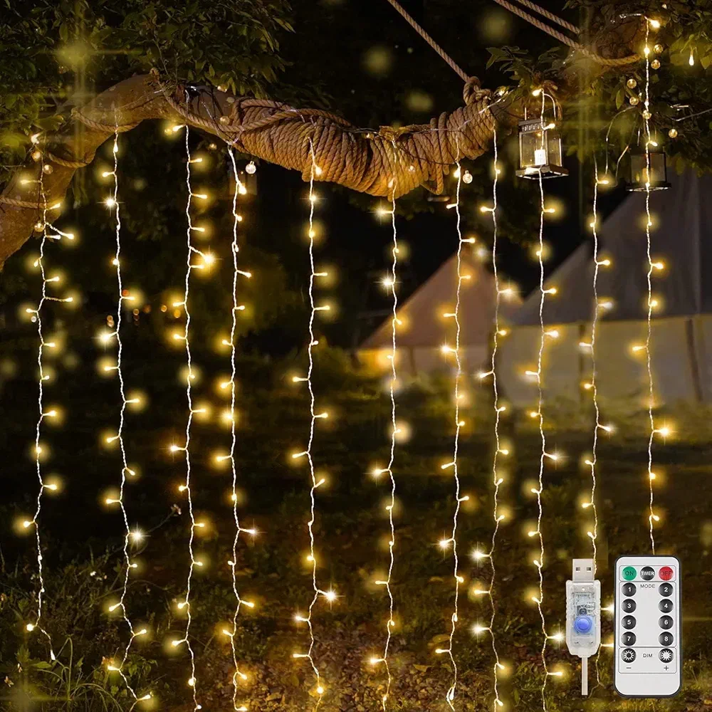 SUDDUS curtain-style LED lights draped over a bedroom wall for cozy ambiance.