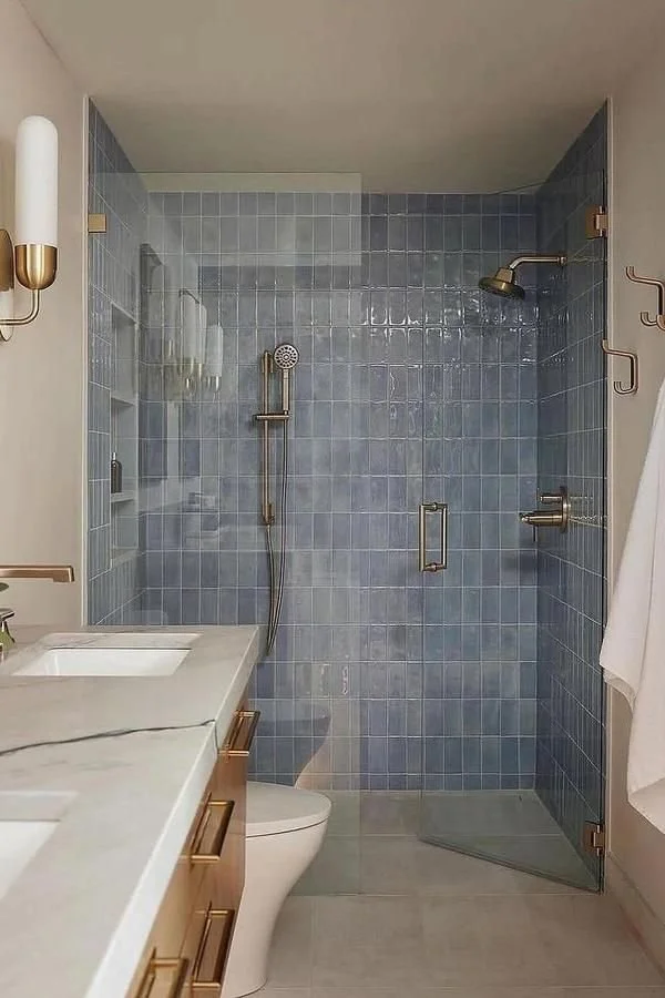 modern-blue-tile-shower-brass-fixtures