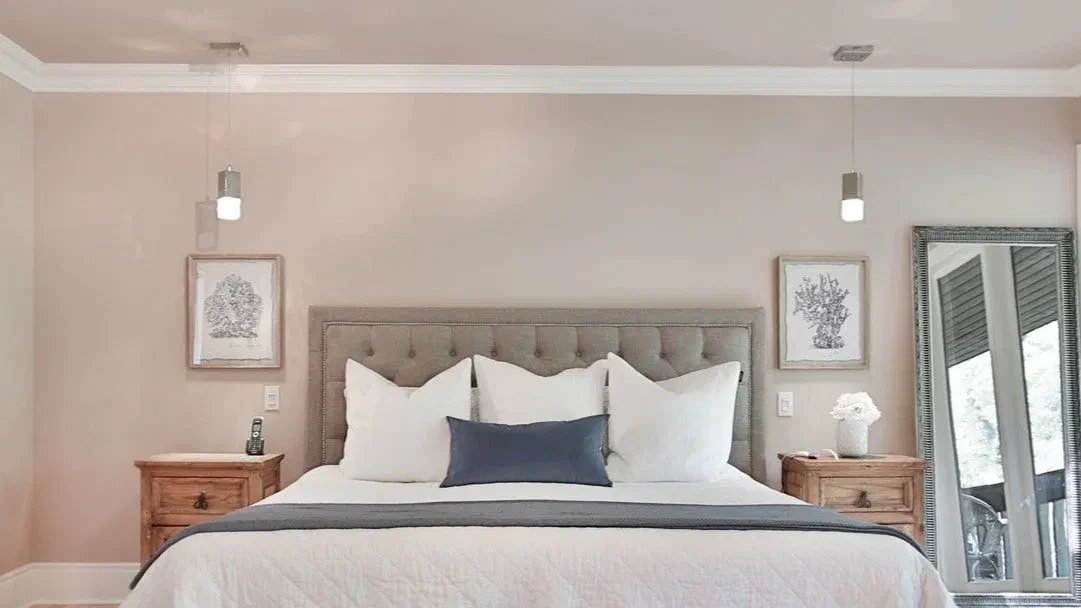 This bedroom shows you don’t need a big ceiling light! Check out the hanging lights by the bed, a cool way to light your room.