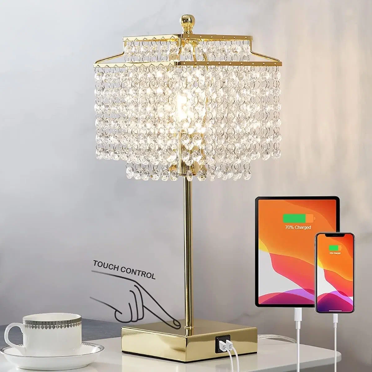 Elegant crystal table lamp with gold finish and USB ports creating ambient light patterns on bedroom wall