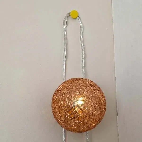 Easy fairy light hanging with pin, copper ball light on wall
