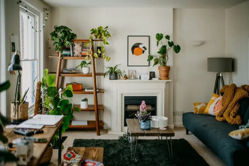 Strategically placed lamps and a wall sconce illuminate this living room