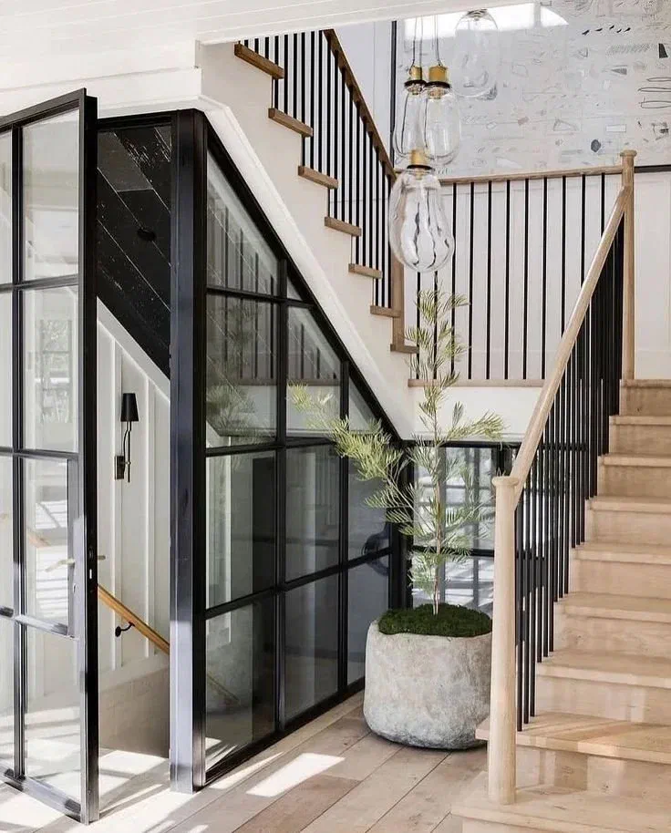 Modern black and white staircase with glass walls