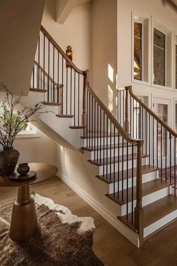 Wood staircase with black metal railings